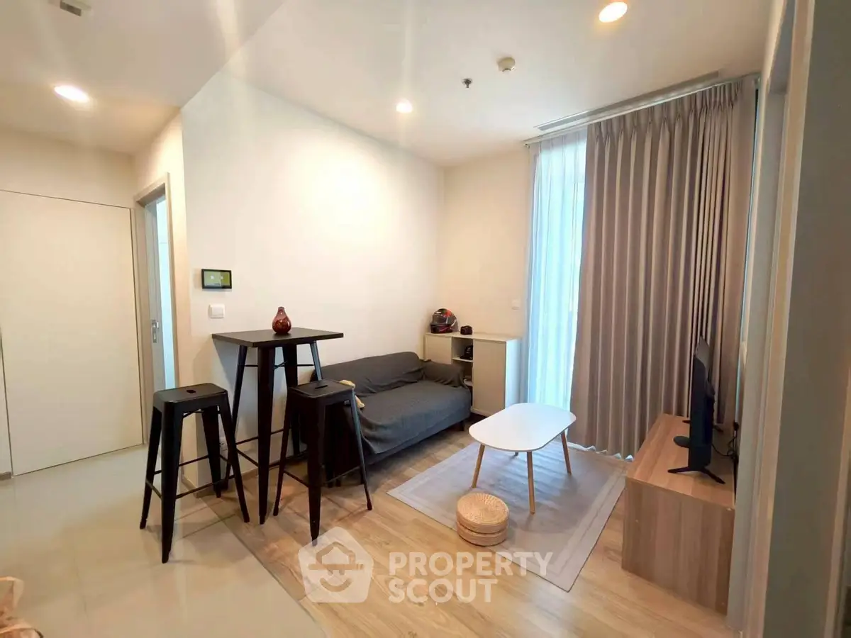 Modern living room with cozy seating and natural light