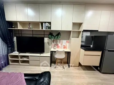 Modern living room with sleek cabinetry and stylish decor