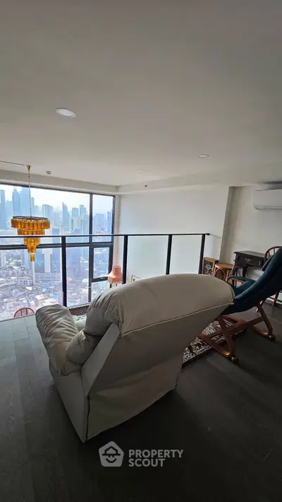 Luxurious high-rise living room with stunning city view and elegant furnishings.