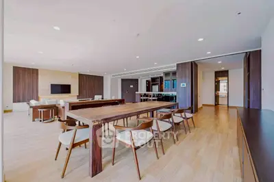 Spacious modern living room with elegant dining area and open layout.