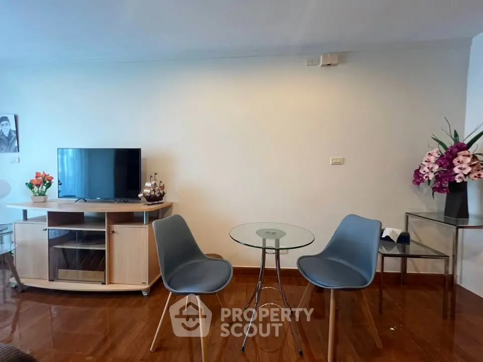 Stylish living room with modern furniture and sleek TV stand, perfect for contemporary living.