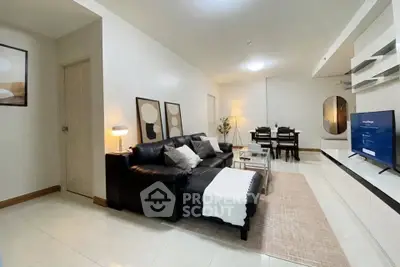 Spacious living room with modern decor and cozy seating area