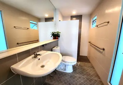 Modern bathroom with sleek design and ample natural light
