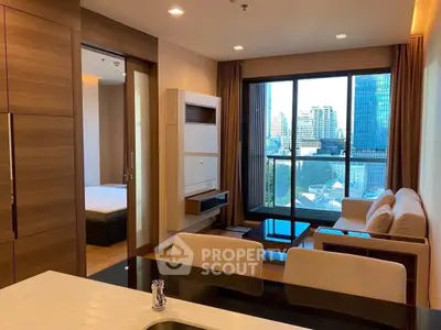 Modern apartment interior with open living room and city view balcony.
