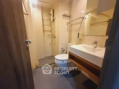 Modern bathroom with sleek fixtures and spacious shower area