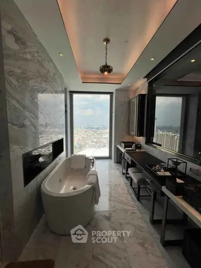 Luxurious bathroom with stunning city view, featuring a modern bathtub and elegant marble finishes.