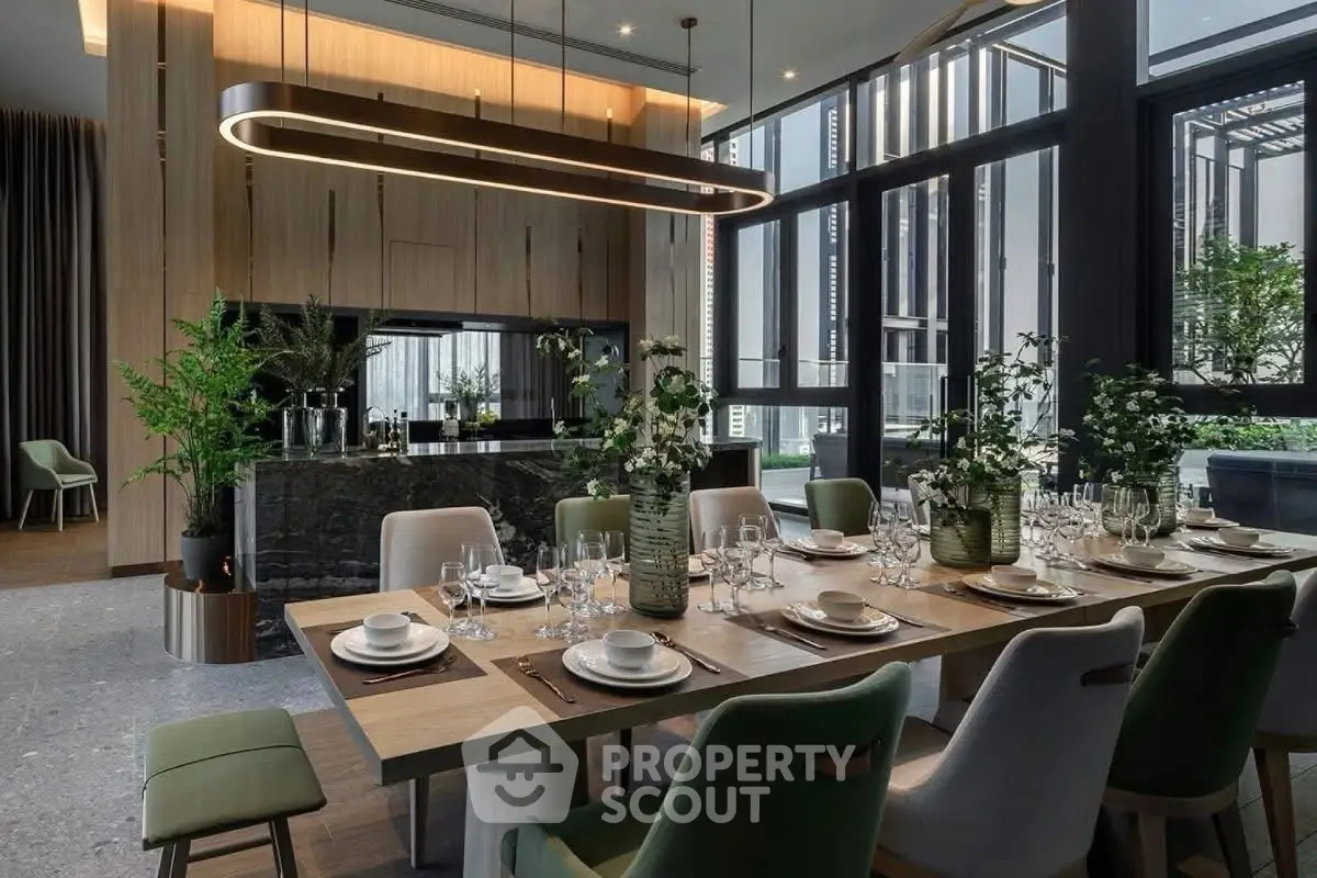 Luxurious dining area with modern decor and large windows offering natural light.