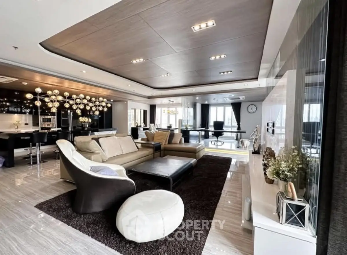 Luxurious open-plan living room with modern decor and elegant lighting