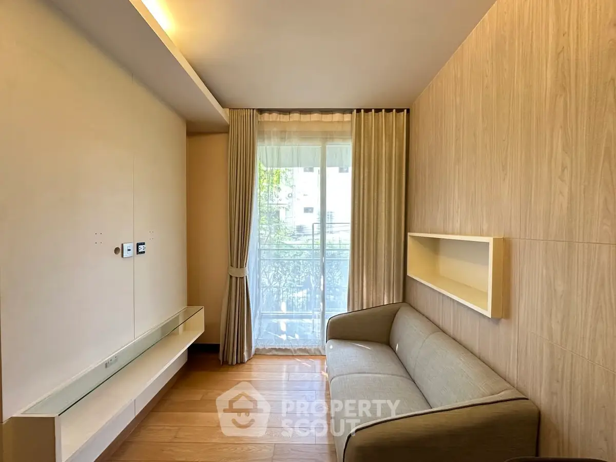 Cozy living room with modern sofa and large window for natural light