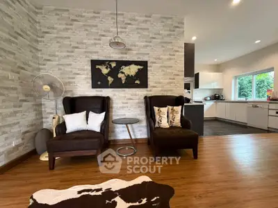 Stylish living room with modern decor and open kitchen layout