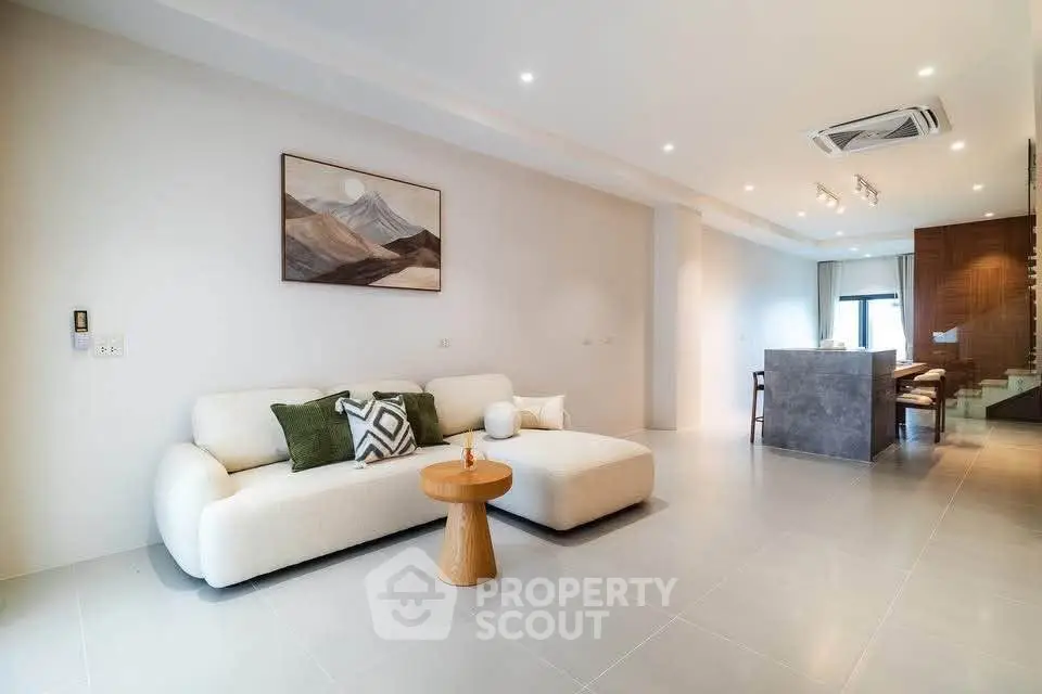 Spacious modern living room with elegant decor and open layout, perfect for relaxation and entertaining.
