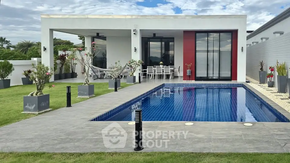 Luxurious modern villa with private pool and stylish outdoor seating area, perfect for relaxation and entertainment.