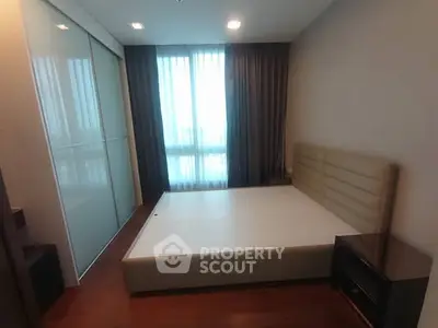 Modern bedroom with sleek design and ample natural light