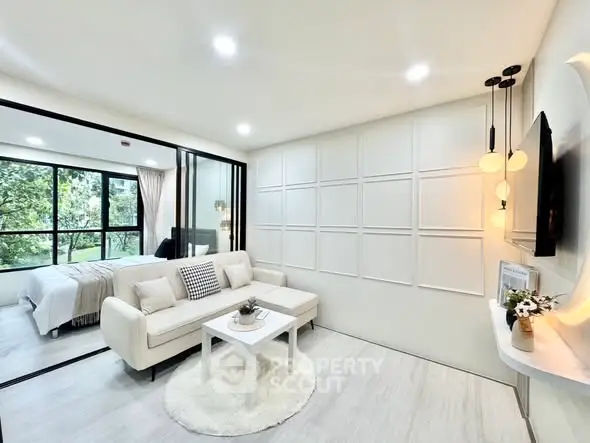 Modern living room with elegant decor and large windows in a stylish apartment.