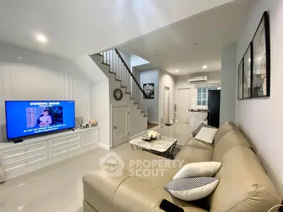 Spacious modern living room with cozy beige sofa and stylish decor