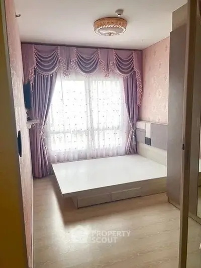 Elegant bedroom with luxurious drapes and modern platform bed frame