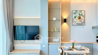 Modern living room with wall-mounted TV and stylish dining area