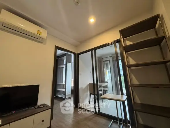 Modern apartment interior with air conditioning and sliding glass doors