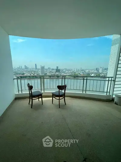 Spacious balcony with stunning city and river view, perfect for relaxation and enjoying the skyline.
