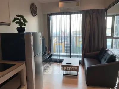 Modern living room with city view, featuring sleek furniture and natural light.