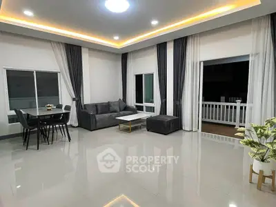 Spacious modern living room with elegant decor and large windows