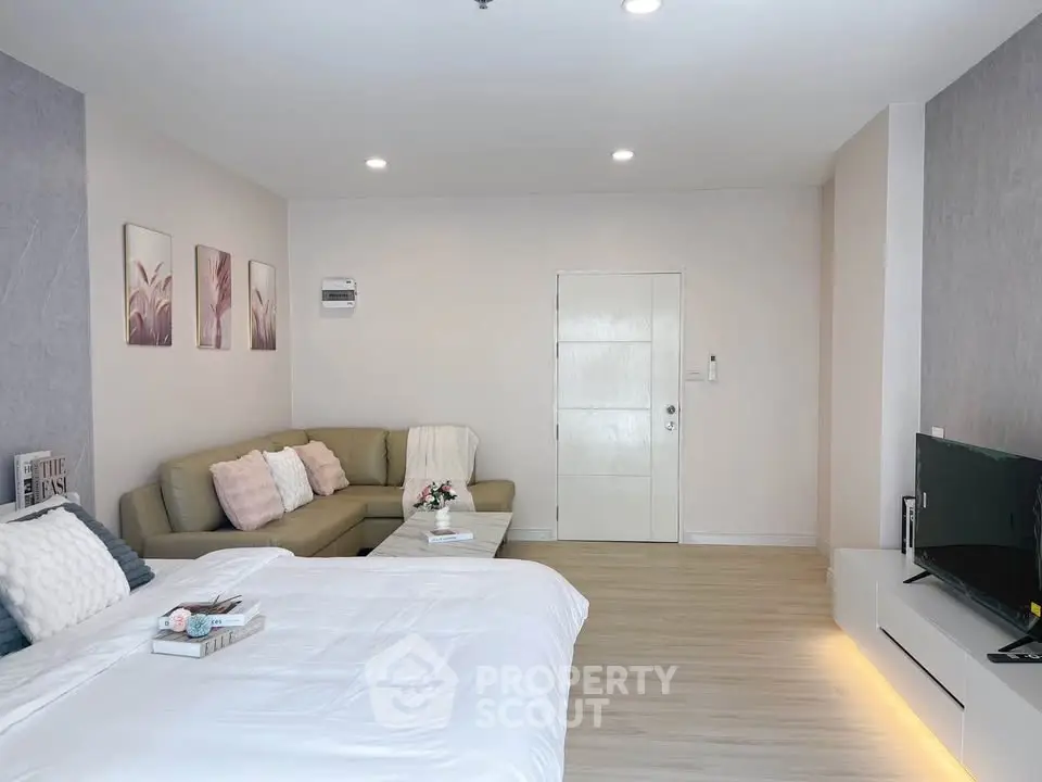 Spacious modern living room with cozy seating and stylish decor