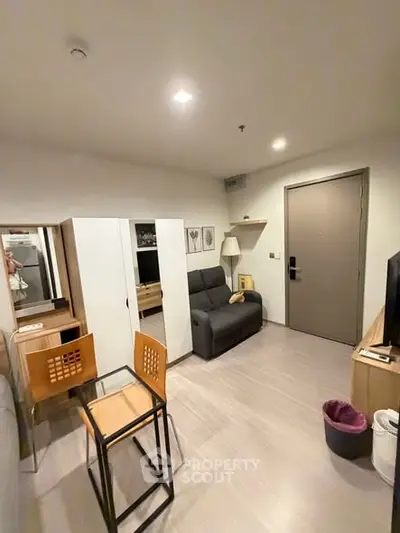 Cozy modern living room with compact dining area and stylish decor