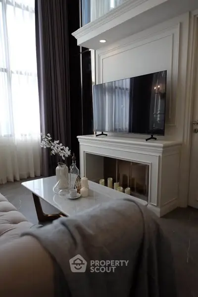 Elegant living room with modern TV setup and stylish decor