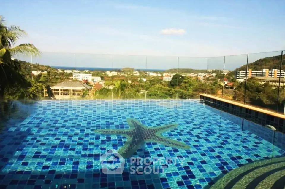 Stunning infinity pool with panoramic views of lush greenery and distant ocean horizon.