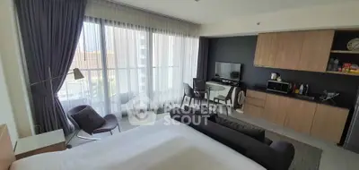 Modern studio apartment with open layout and large windows