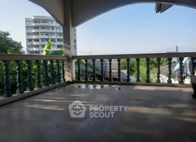 Spacious balcony with scenic view in modern apartment building