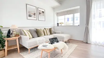 Bright and airy living room with modern decor and large window