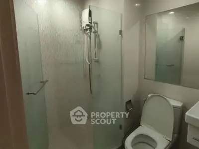 Modern bathroom with glass shower and sleek fixtures