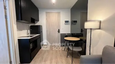 Modern compact kitchen and dining area in stylish apartment