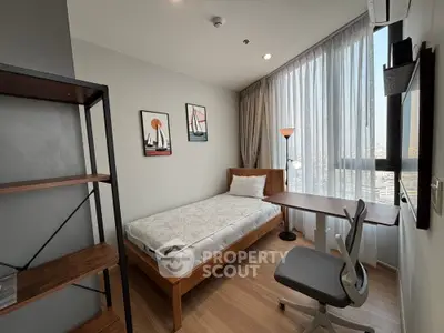 Modern bedroom with large window, wooden floor, and stylish decor