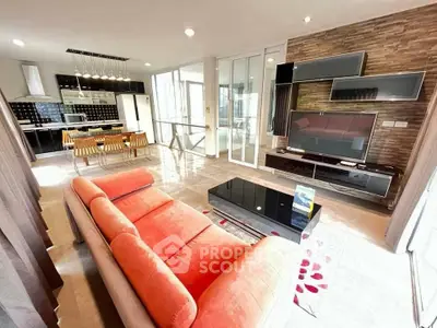 Spacious modern living room with open kitchen and stylish decor