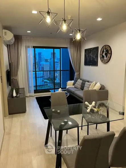 Modern living room with stylish decor and city view balcony