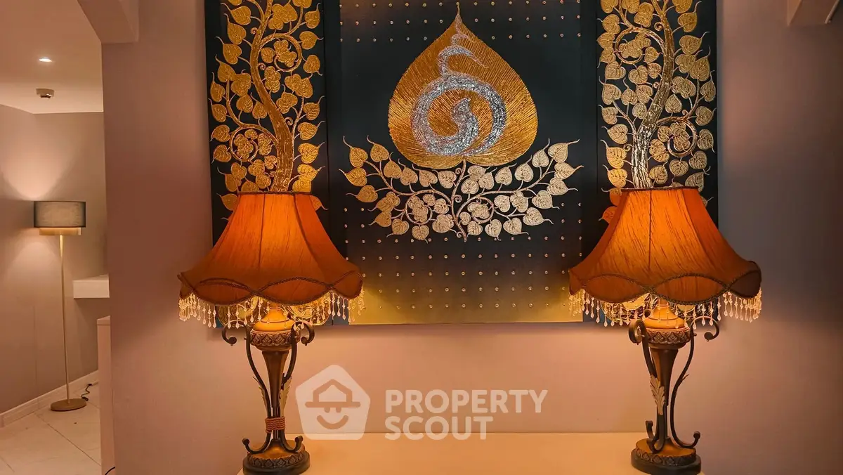 Elegant interior with ornate lamps and decorative wall art