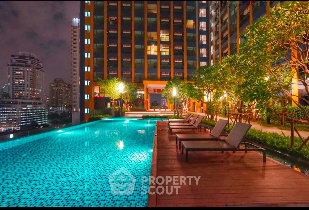 Luxurious rooftop pool with city skyline view, perfect for urban relaxation and entertainment.