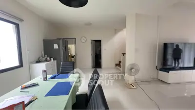 Spacious modern living room with dining area and sleek furniture