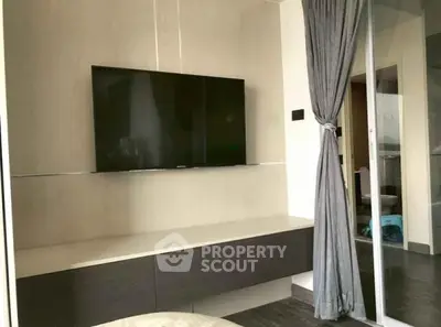 Modern living room with wall-mounted TV and stylish decor