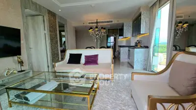 Luxurious living room with elegant decor and open kitchen layout