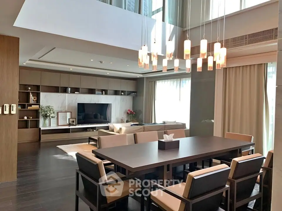 Luxurious modern living room with high ceilings and elegant dining area