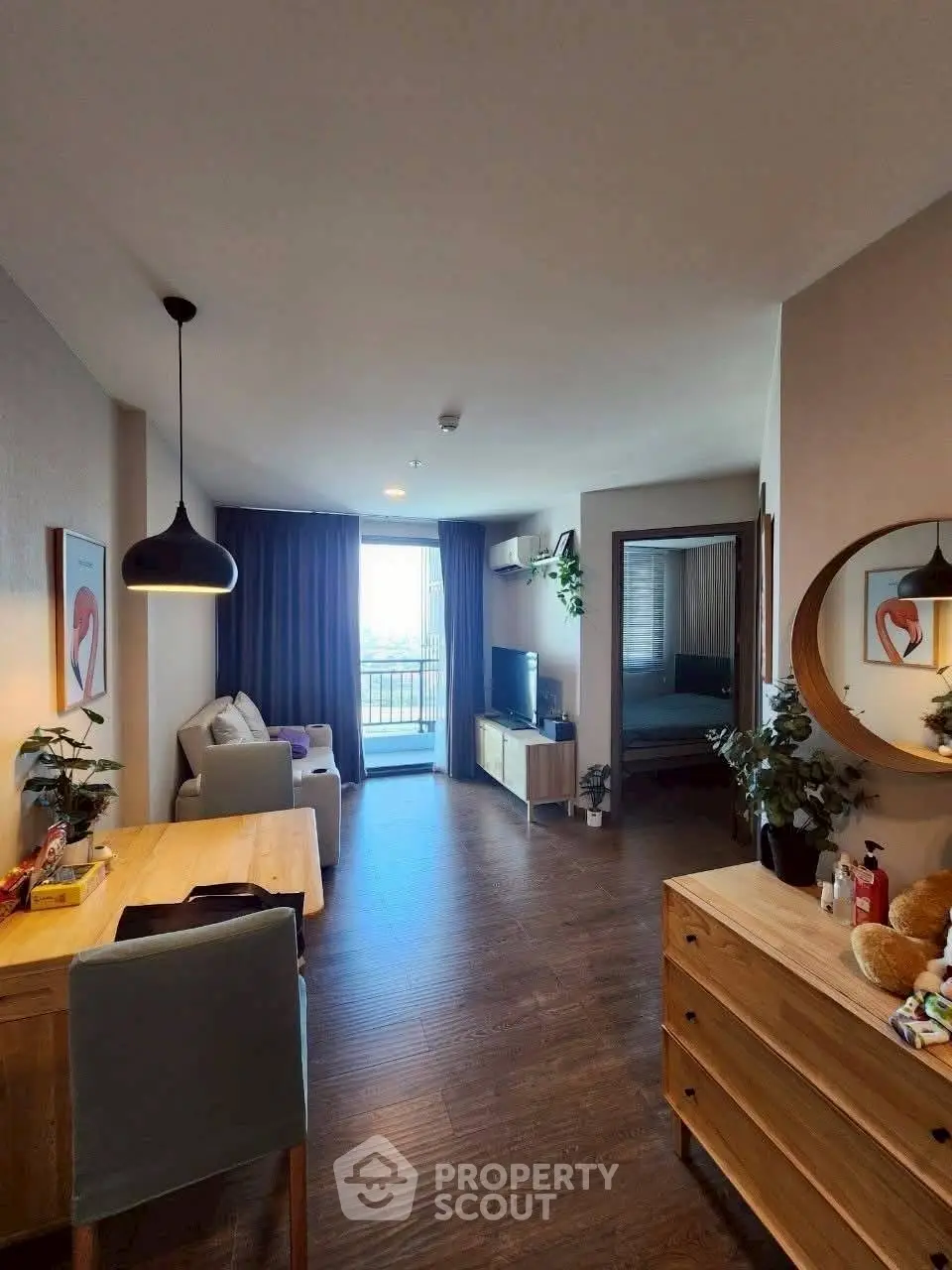 Modern living room with stylish decor and balcony view