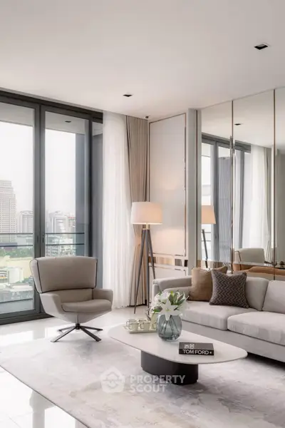 Luxurious modern living room with floor-to-ceiling windows and elegant decor in a high-rise apartment.