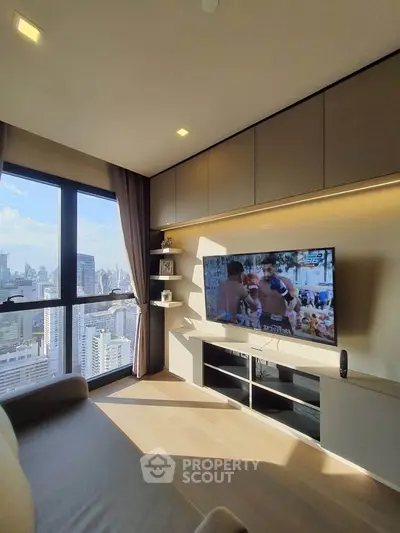 Luxurious living room with stunning city view and modern entertainment setup.