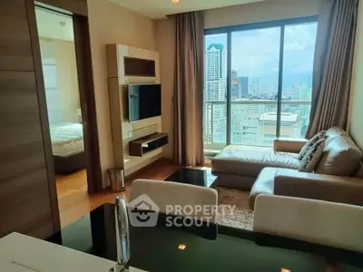 Luxurious living room with city view, modern furniture, and elegant decor in high-rise apartment.