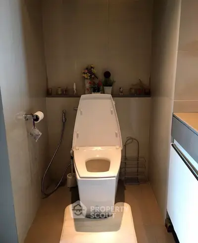 Modern bathroom with sleek toilet and minimalistic design