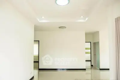 Spacious empty room with modern lighting and glossy floors