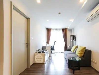 Modern living room with sleek furniture and natural light, perfect for urban living.